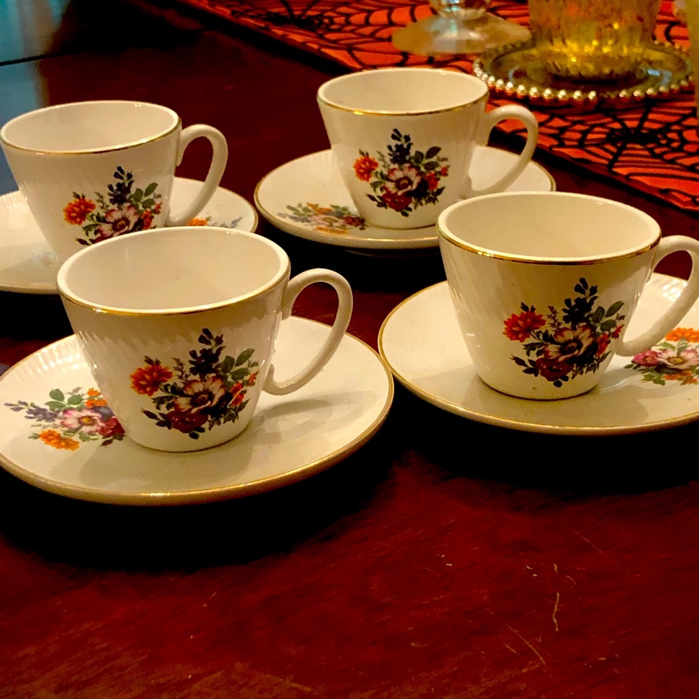 A 4 piece set of demitasse cups with sugar container.